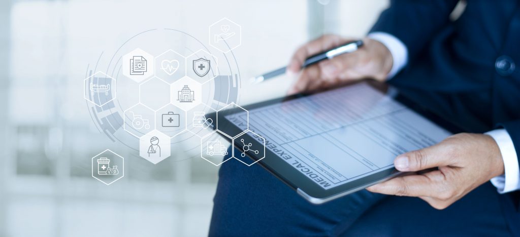 Man sitting with tablet and pen about to sign an agreement electronically