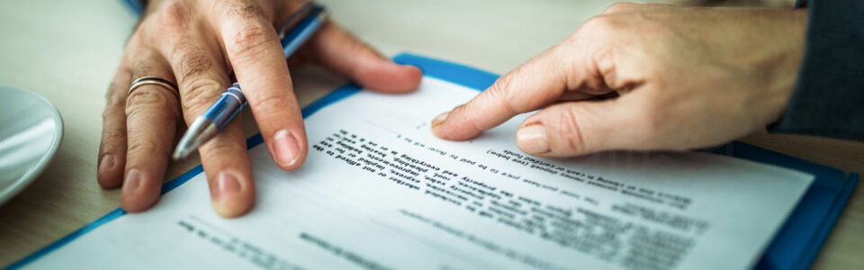 Signing a contract that needs bank contract management software