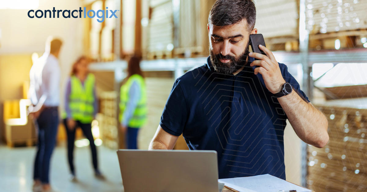 Business owner using vendor contract management software in warehouse.