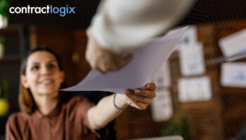 Business professionals engaged in enterprise contract management, emphasizing the importance of documentation.