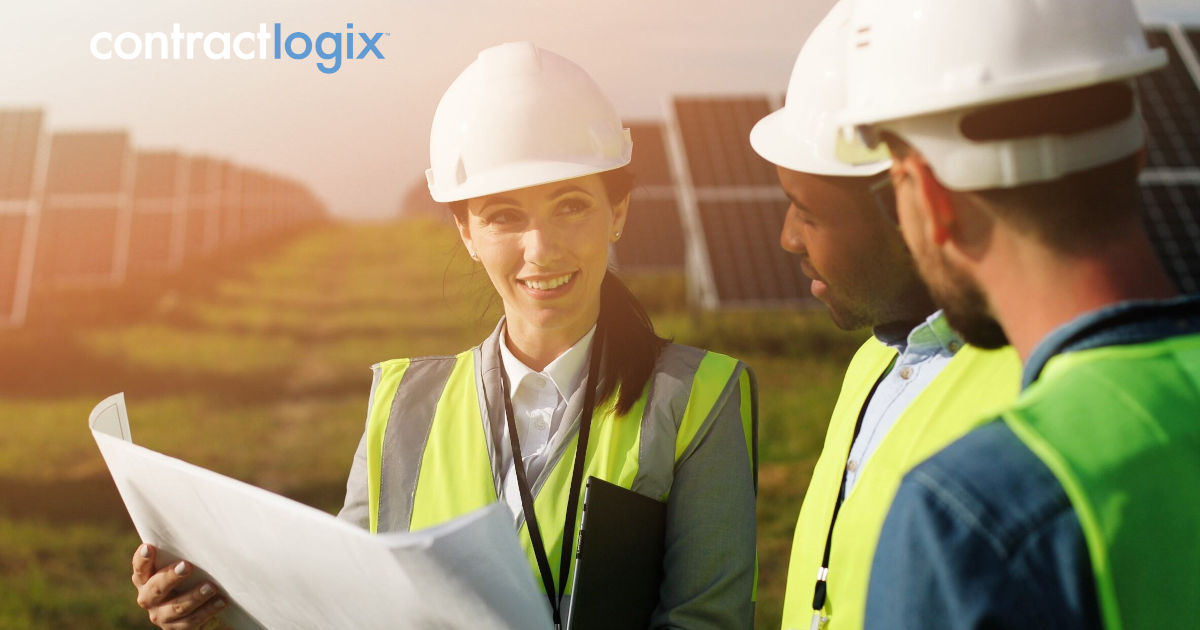Woman holds document as she speaks with two men about navigating contract management data in the energy industry