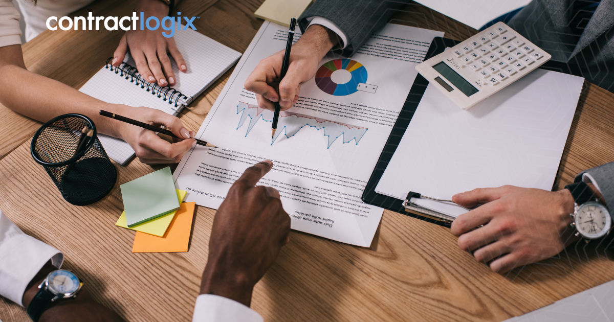 business team sits at desk in office and analyze contract lifecycle management trends