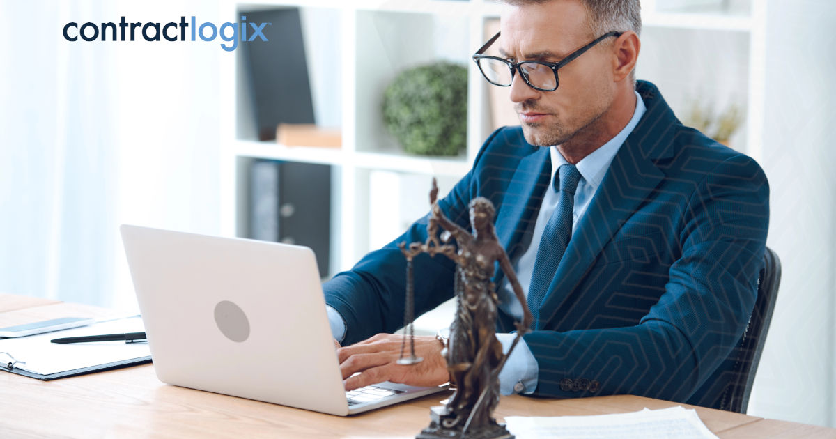 man with glasses sits at desk and uses CLM software for municipalities on computer