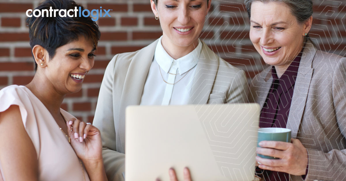 smiling businesswomen look at a laptop to understand Features of Contract Management Software