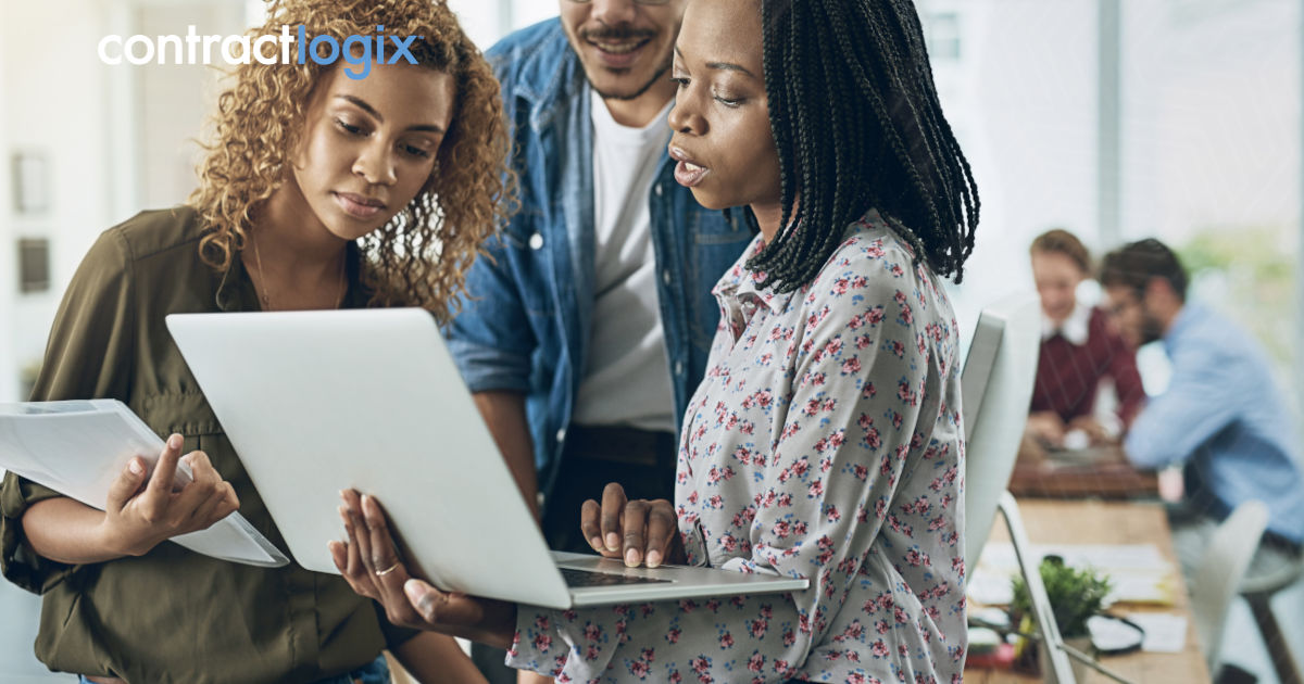 team works on computer in an office and uses contract tracking software software to optimize contract management