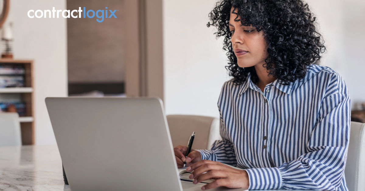 female business owner sits at desk and uses laptop computer to use mid-sized business contract software