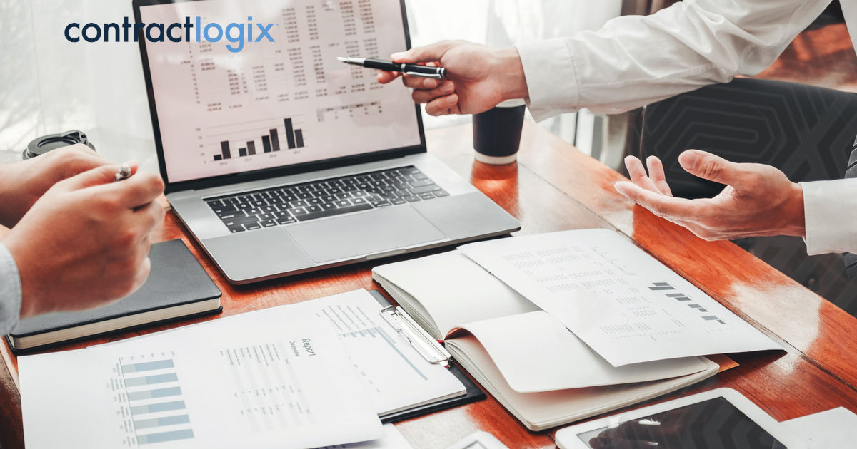 Individual using a computer to managing contract management processes through the use of contract lifecycle management software.