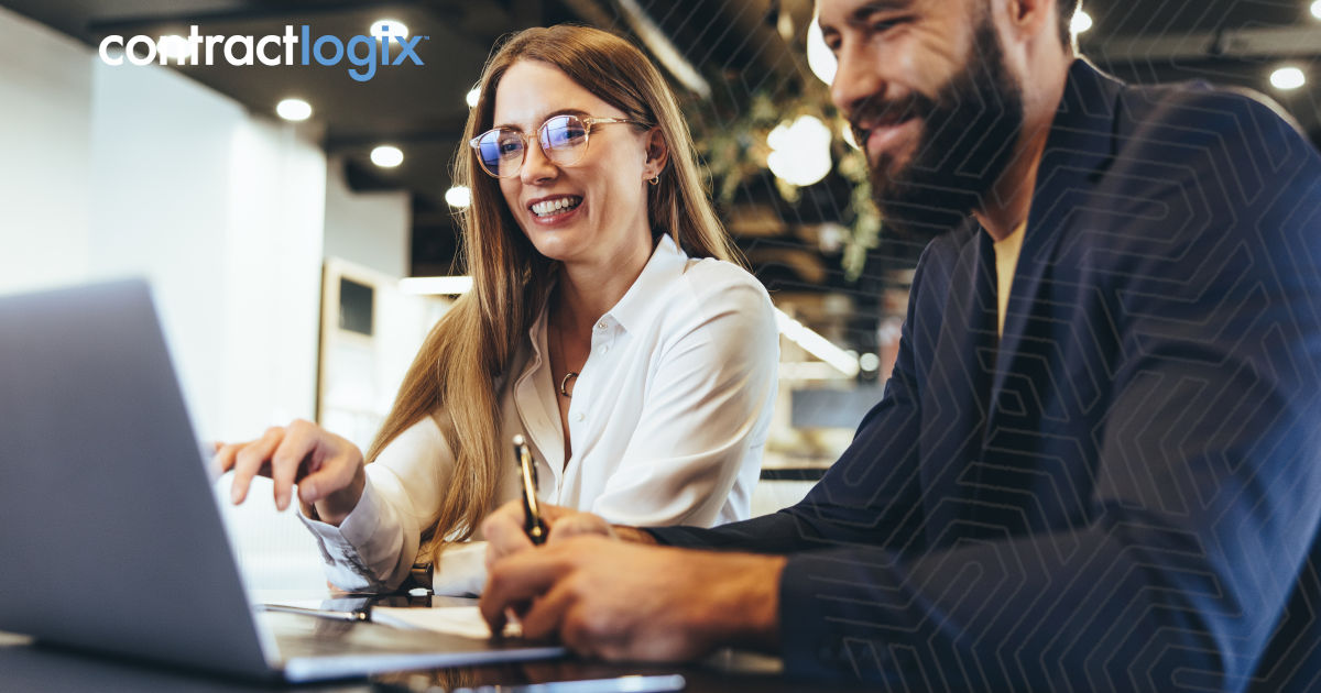 smiling legal professionals use contract AI analysis and data extraction to optimize their contract lifecycle management
