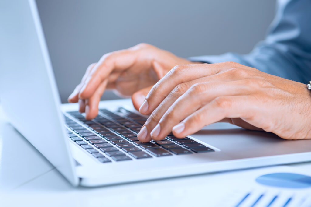 close up of business person using software for contract management in procurement