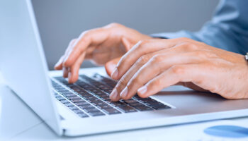 close up of business person using software for contract management in procurement