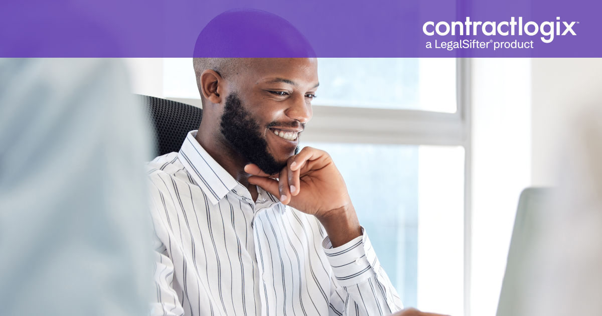 happy man sits in office on laptop computer after learning how Contract Management Supports Business Continuity