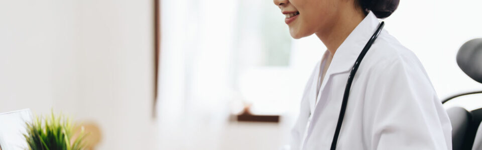 female healthcare professional using computer for contract management in healthcare