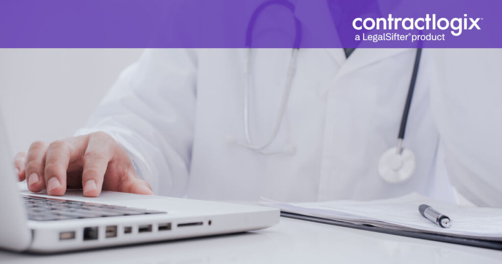 doctor working with hospital contract management software on laptop computer