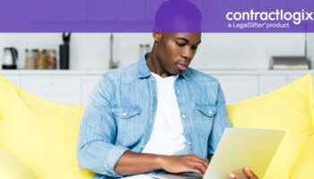 man sitting on couch using computer to learn what is contract management