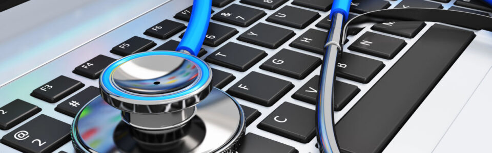 stethoscope on laptop keyboard to represent the best healthcare contract management software