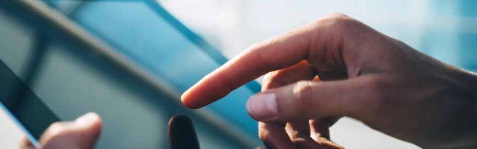 hand uses tablet for contract administration services