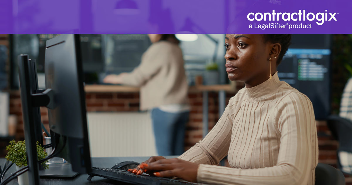 female businesswoman sits at desktop computer and learns about contract management consulting services