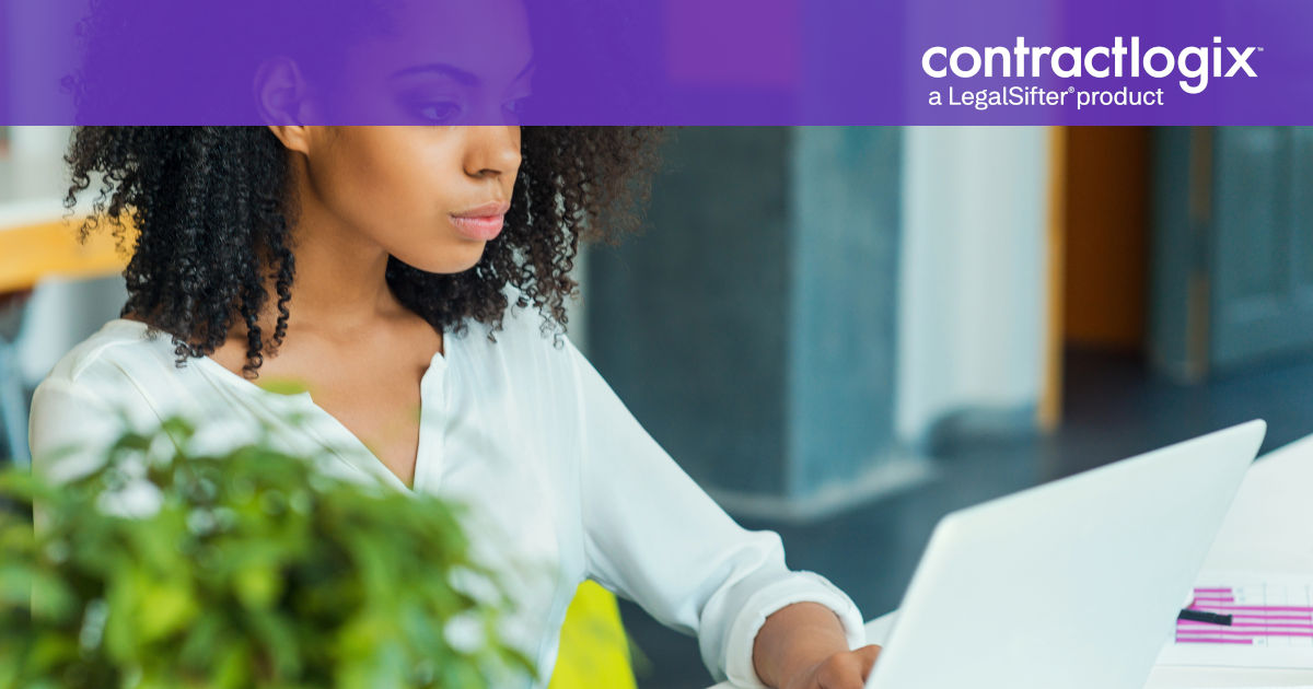 young woman sitting at desk learning about managed services for contract operations on laptop computer