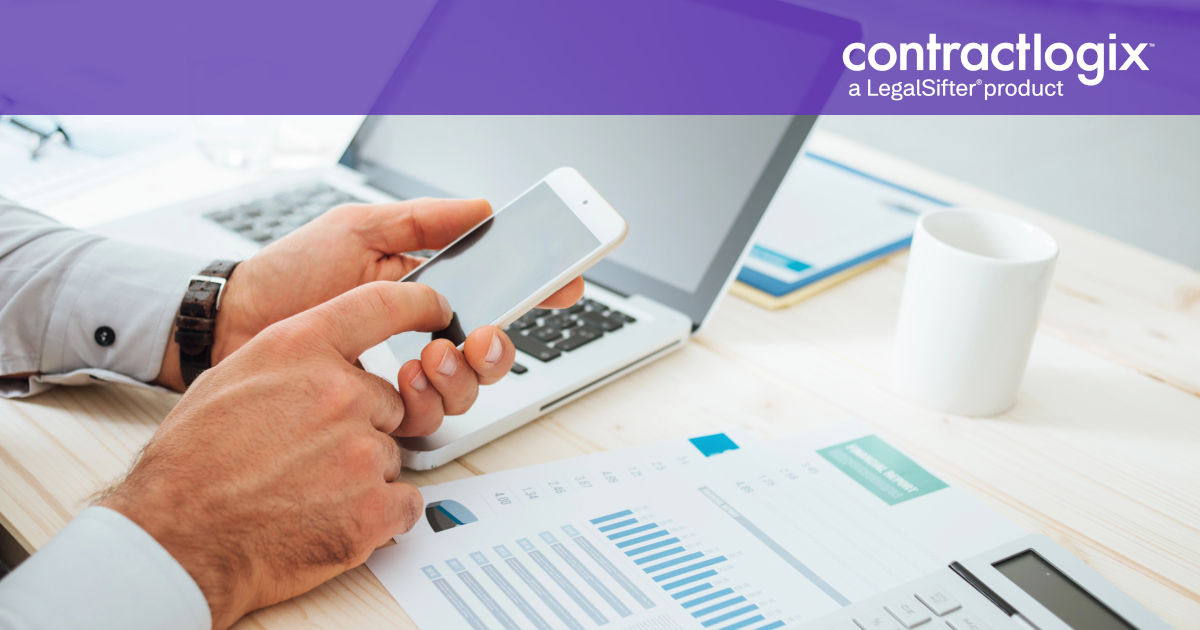 business man at desk using technology to calculate contract management OKRs